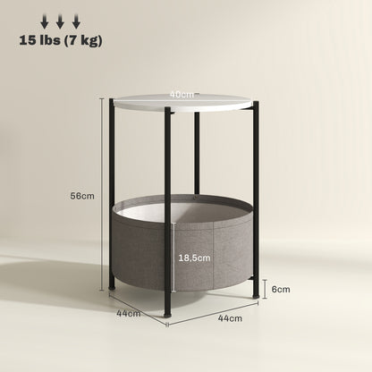 Mesa auxiliar / lateral para salón o dormitorio con almacenamiento - Mesa redonda de café con canasta de tela - Estructura de metal negro, sobre blanco y tela gris, 44x44x56cm